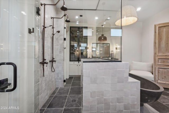 bathroom featuring walk in shower and vanity