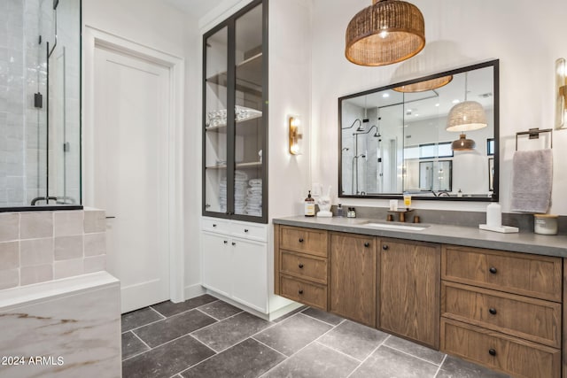 bathroom with an enclosed shower and vanity