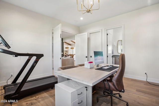 office area with a chandelier and hardwood / wood-style flooring