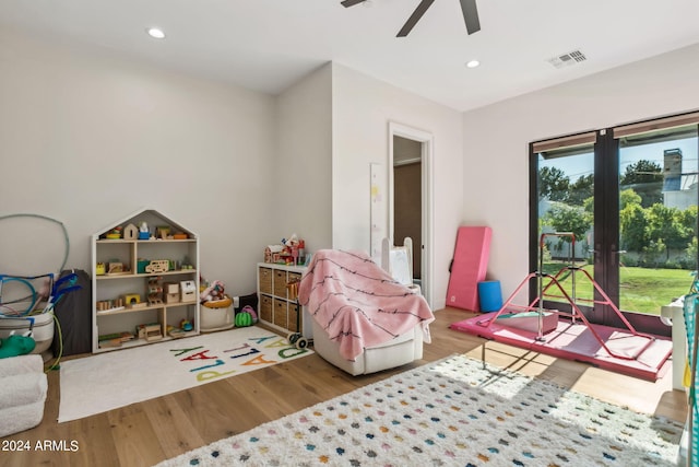 recreation room featuring hardwood / wood-style flooring and ceiling fan