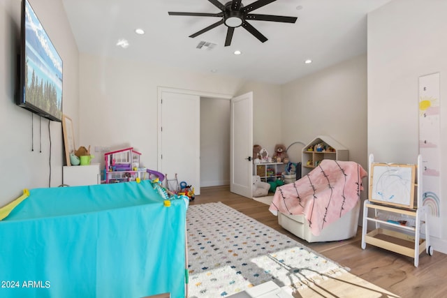 bedroom featuring ceiling fan and light hardwood / wood-style floors