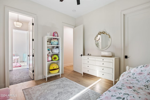 bedroom featuring ceiling fan and light hardwood / wood-style flooring