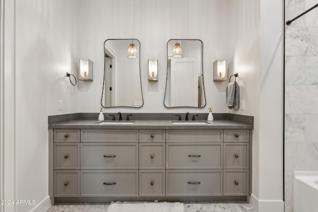 bathroom featuring vanity and a tub to relax in