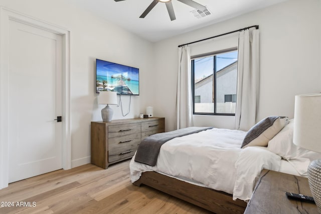 bedroom with light wood-type flooring and ceiling fan