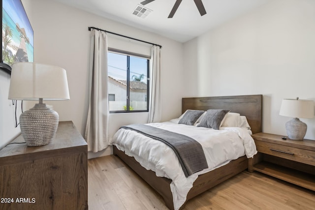 bedroom featuring ceiling fan and light hardwood / wood-style flooring