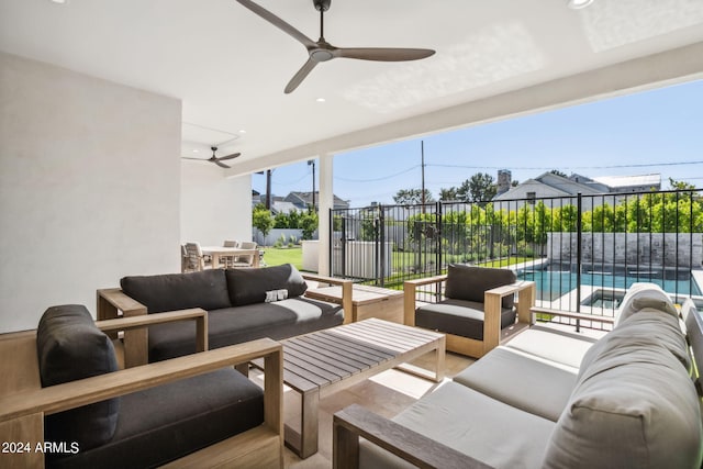 view of patio / terrace with ceiling fan, an outdoor hangout area, and a fenced in pool