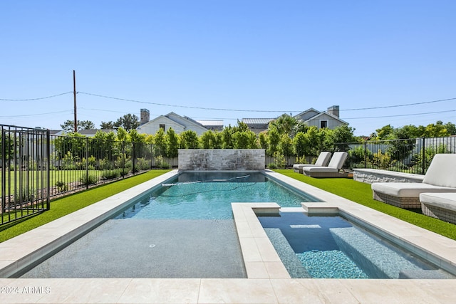 view of pool featuring a yard and an in ground hot tub