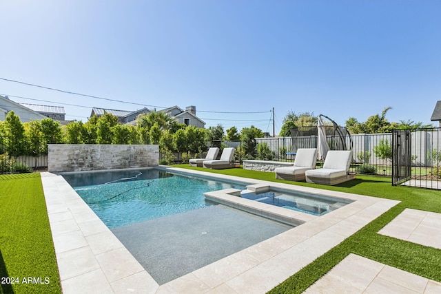 view of pool with a yard, an in ground hot tub, and a patio