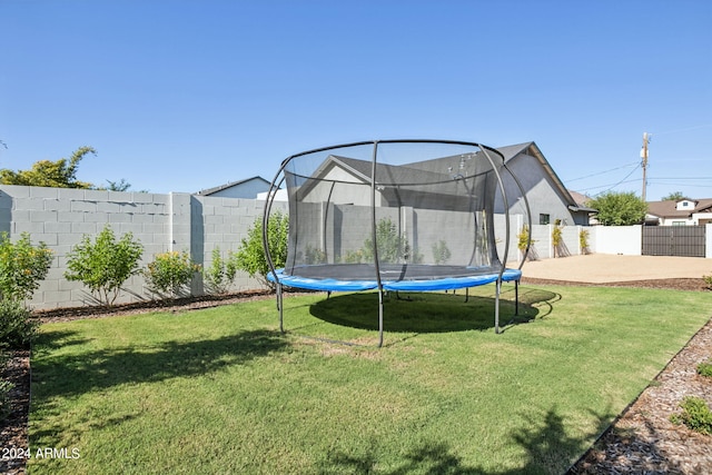 view of yard with a patio area and a trampoline