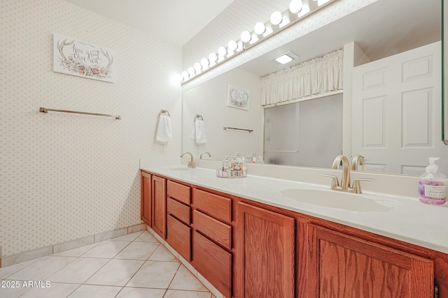 bathroom with tile patterned flooring and vanity