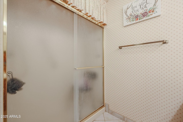 bathroom with tile patterned flooring and walk in shower