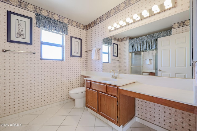 bathroom featuring tile patterned flooring, vanity, and toilet