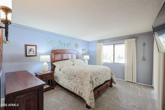 carpeted bedroom with a textured ceiling