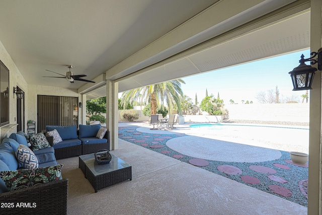 view of patio / terrace with a fenced in pool, an outdoor hangout area, and ceiling fan