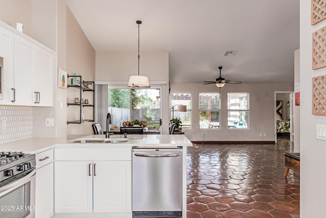 925 W Hudson Way, Gilbert, AZ 85233 - kitchen with appliances with stainless steel finishes, a peninsula, ceiling fan, white cabinets, and backsplash