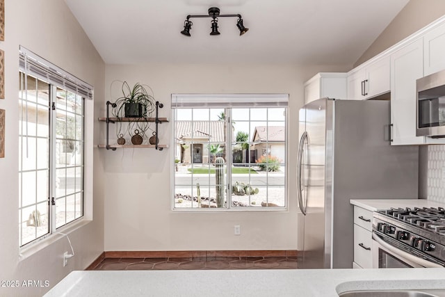 925 W Hudson Way, Gilbert, AZ 85233 - kitchen featuring healthy amount of natural light, white cabinets, light countertops, and vaulted ceiling