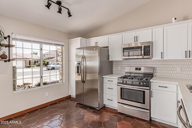 925 W Hudson Way, Gilbert, AZ 85233 - kitchen featuring stainless steel appliances, light countertops, vaulted ceiling, backsplash, and white cabinetry