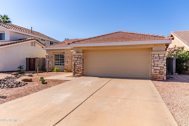 925 W Hudson Way, Gilbert, AZ 85233 - view of front of house featuring stone siding, driveway, stucco siding, and an attached garage