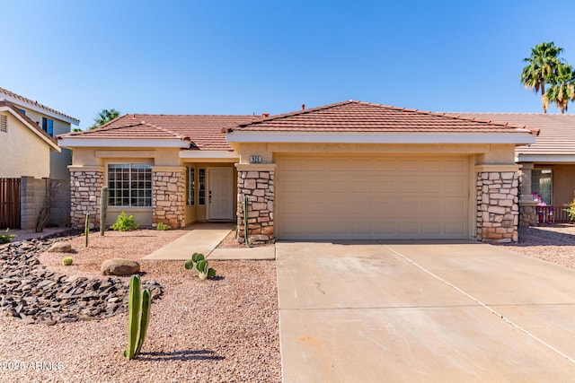 925 W Hudson Way, Gilbert, AZ 85233 - view of front of property with stone siding, stucco siding, an attached garage, concrete driveway, and a tiled roof