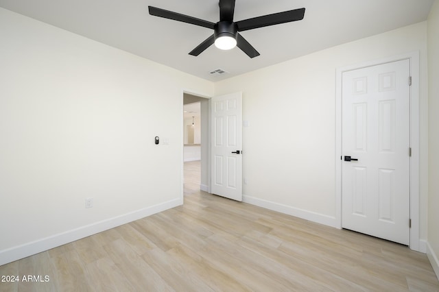 unfurnished bedroom featuring ceiling fan and light wood-type flooring