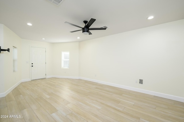 empty room featuring light hardwood / wood-style flooring and ceiling fan