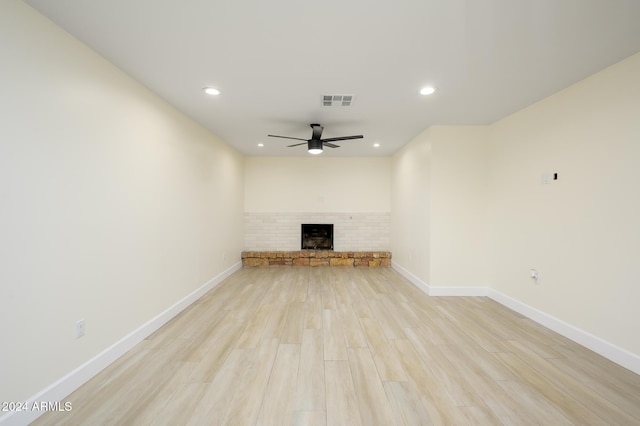 unfurnished living room featuring ceiling fan and light hardwood / wood-style floors