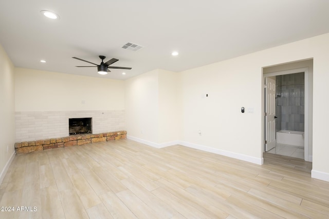 unfurnished living room with ceiling fan and light wood-type flooring