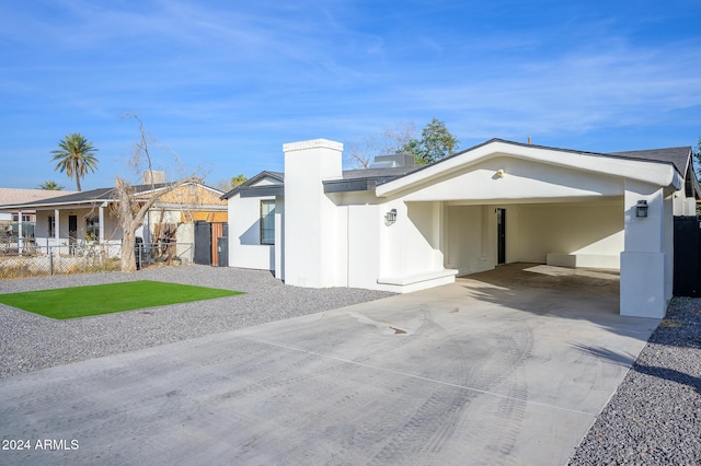 view of front facade with a carport