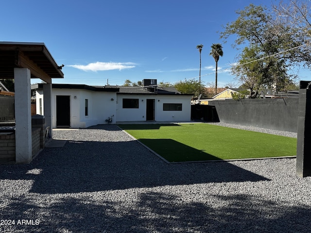 view of yard featuring central AC and a patio