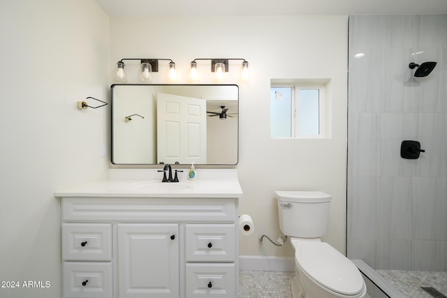 bathroom with tile patterned flooring, vanity, toilet, and walk in shower