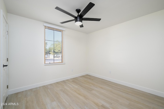 unfurnished room with ceiling fan and light hardwood / wood-style floors