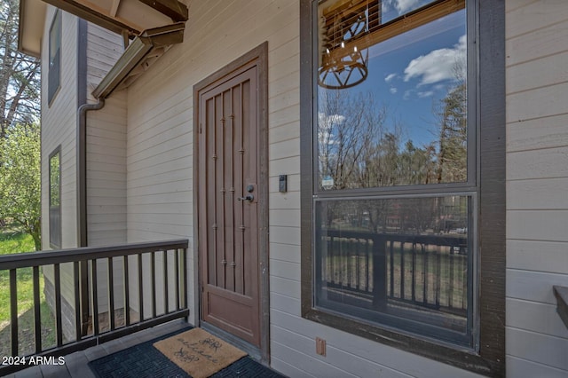 view of exterior entry featuring a porch