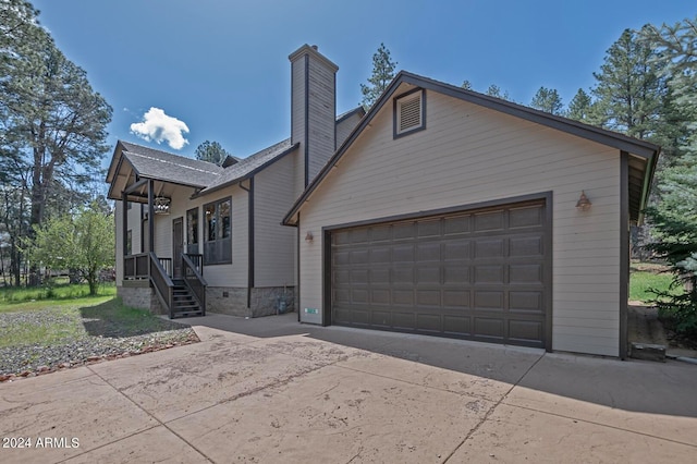 view of side of home with a porch