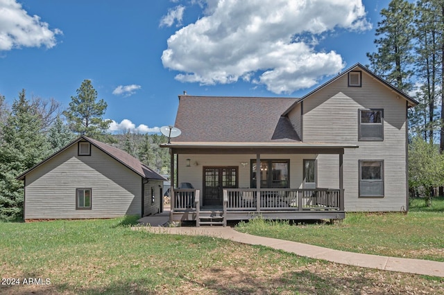 back of house with a lawn and a porch