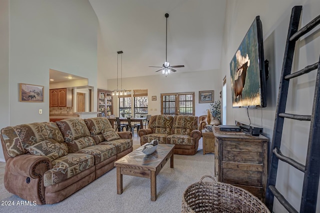 living room featuring ceiling fan, light colored carpet, and high vaulted ceiling