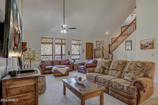 living room with light carpet, high vaulted ceiling, and ceiling fan