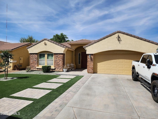 3592 E Sandwick Dr, San Tan Valley, AZ 85140 - mediterranean / spanish home featuring an attached garage, stone siding, concrete driveway, a front lawn, and stucco siding