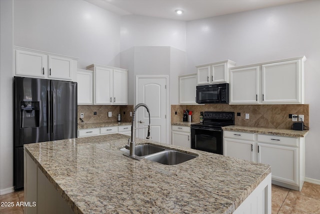 3592 E Sandwick Dr, San Tan Valley, AZ 85140 - kitchen featuring a high ceiling, a sink, a kitchen island with sink, black appliances, and white cabinetry