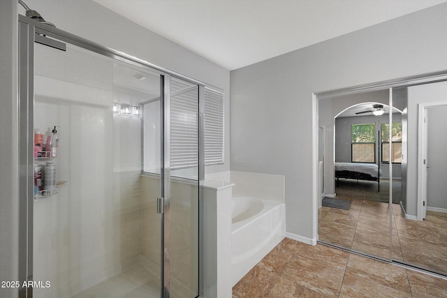 3592 E Sandwick Dr, San Tan Valley, AZ 85140 - bathroom with a bath, a shower stall, ensuite bath, and baseboards