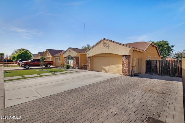 3592 E Sandwick Dr, San Tan Valley, AZ 85140 - mediterranean / spanish-style house featuring concrete driveway, stucco siding, an attached garage, a tiled roof, and fence