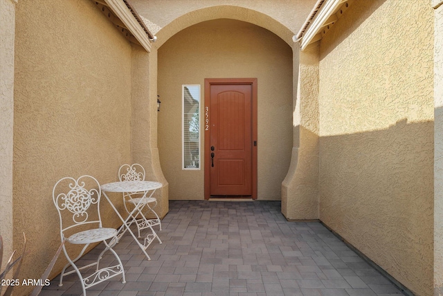 3592 E Sandwick Dr, San Tan Valley, AZ 85140 - property entrance with a patio and stucco siding