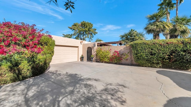 southwest-style home featuring a garage