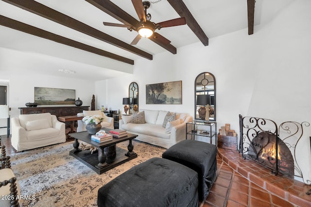 living room with a fireplace, ceiling fan, and beam ceiling