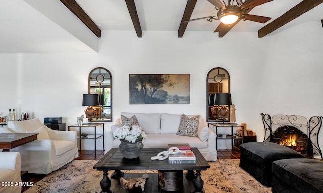 living room with tile patterned floors, ceiling fan, a fireplace, and beam ceiling