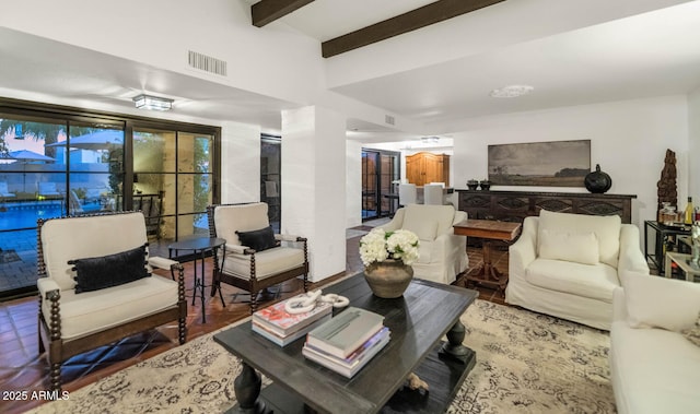 living room featuring beamed ceiling