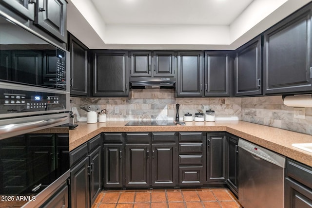 kitchen featuring light tile patterned floors, black appliances, and decorative backsplash