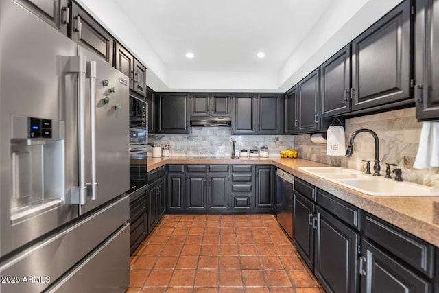 kitchen featuring stainless steel appliances, tile patterned floors, decorative backsplash, and sink