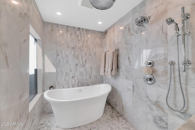 bathroom featuring tile walls and independent shower and bath