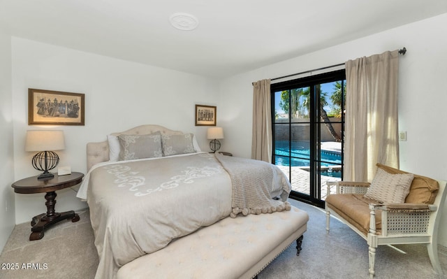 bedroom with access to outside and light colored carpet