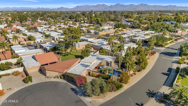 birds eye view of property with a mountain view